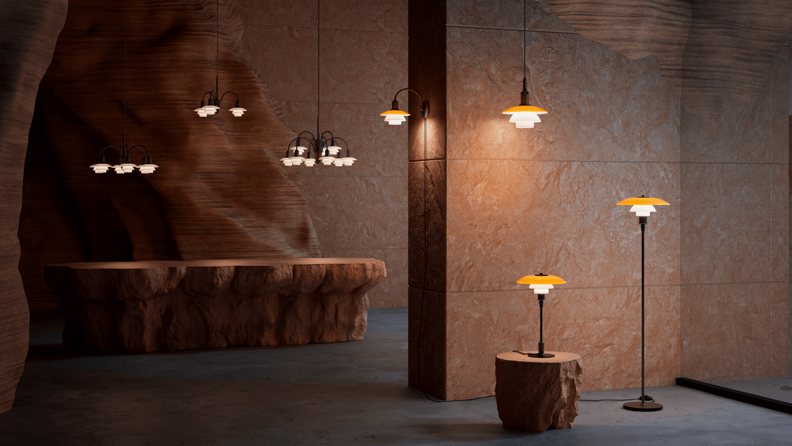 PH Centenary collection illuminating a sculptural stone interior, © 2025 Louis Poulsen.