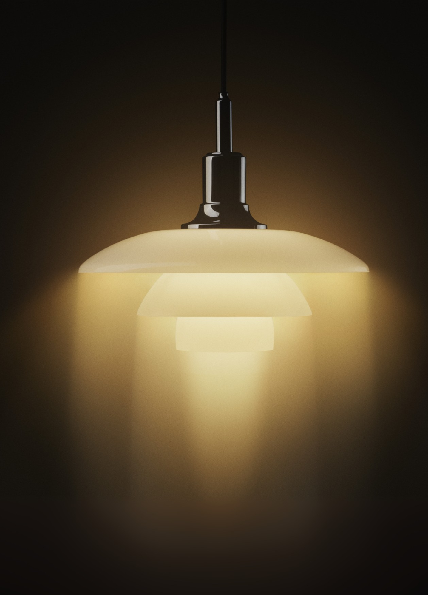 PH 3/2 pendant lamp glowing warmly in the dark, © 2025 Louis Poulsen.